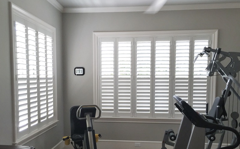 Dover fitness room with shuttered windows.